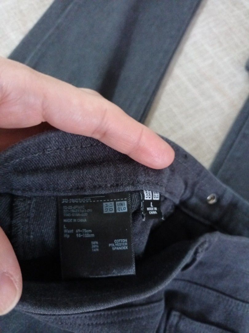 Dark Grey Slim Fit Stretch Pants (Category: Jeans) located in Quezon. Submitted by ja8720 (Listing ID 1469477115, Image 2). Description: - Color: Dark Grey - Fit: Slim fit, ankle length - Waist: Mid-rise with button closure and belt loops - Pockets: Two front scoop pockets, two back patch pockets - Material: Stretchy and comfortable fabric - Versatility: Easy to match for office or daily wear.