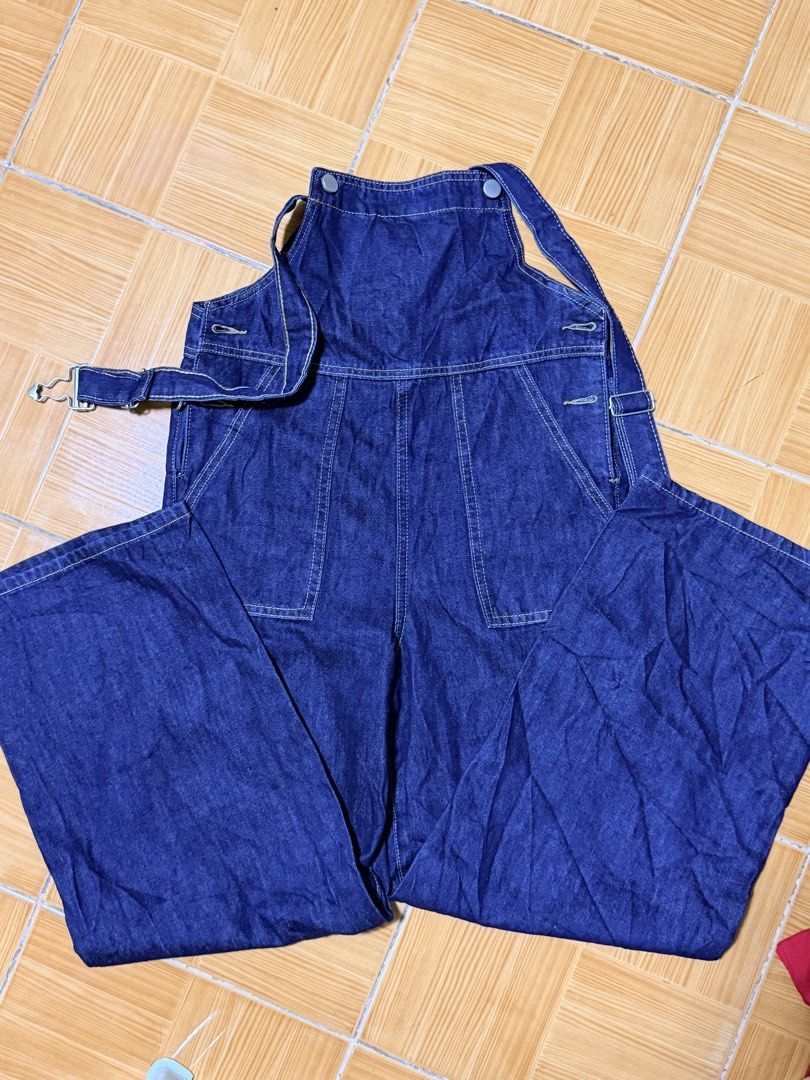 Dark wash denim overalls with front pockets and straps (Category: Babies & Kids Fashion) located in Paete. Submitted by skydruemadison (Listing ID 1469509653, Image 3). Description: - Color: Dark blue denim - Cut: Relaxed wide-leg style - Pockets: Deep front pockets on both sides - Details: Contrast stitching and metal hardware - Fit: Comfortable with adjustable back straps - Styling: Perfect for layering over plain t-shirts or hoodies.