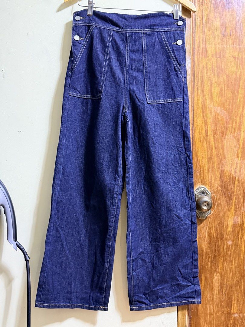 Dark wash denim overalls with front pockets and straps (Category: Babies & Kids Fashion) located in Paete. Submitted by skydruemadison (Listing ID 1469509653, Image 1). Description: - Color: Dark blue denim - Cut: Relaxed wide-leg style - Pockets: Deep front pockets on both sides - Details: Contrast stitching and metal hardware - Fit: Comfortable with adjustable back straps - Styling: Perfect for layering over plain t-shirts or hoodies.