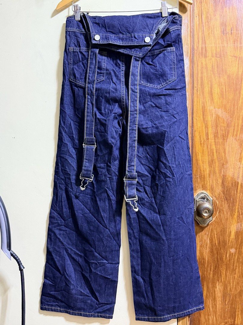 Dark wash denim overalls with front pockets and straps (Category: Babies & Kids Fashion) located in Paete. Submitted by skydruemadison (Listing ID 1469509653, Image 2). Description: - Color: Dark blue denim - Cut: Relaxed wide-leg style - Pockets: Deep front pockets on both sides - Details: Contrast stitching and metal hardware - Fit: Comfortable with adjustable back straps - Styling: Perfect for layering over plain t-shirts or hoodies.