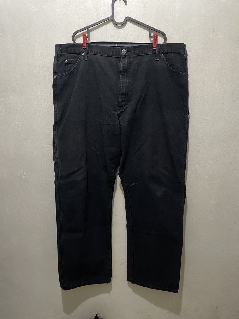 Dickies Black Workwear Pants Carpenter Jeans (Category: Jeans) located in Manila. Submitted by bigboyzcloset (Listing ID 1469419078, Image 3). Description: - Brand: Dickies - Item: Carpenter Pants - Color: Black - Material: Heavy-duty cotton canvas - Features: Utility pockets, hammer loop, branded metal hardware, and red logo patch - Fit: Regular fit with standard belt loops - Condition: Minor fading from regular use, durable and still has plenty