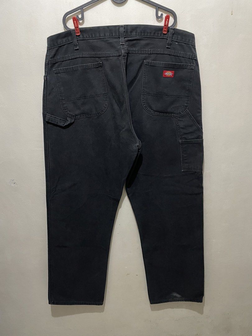 Dickies Black Workwear Pants Carpenter Jeans (Category: Jeans) located in Manila. Submitted by bigboyzcloset (Listing ID 1469419078, Image 2). Description: - Brand: Dickies - Item: Carpenter Pants - Color: Black - Material: Heavy-duty cotton canvas - Features: Utility pockets, hammer loop, branded metal hardware, and red logo patch - Fit: Regular fit with standard belt loops - Condition: Minor fading from regular use, durable and still has plenty