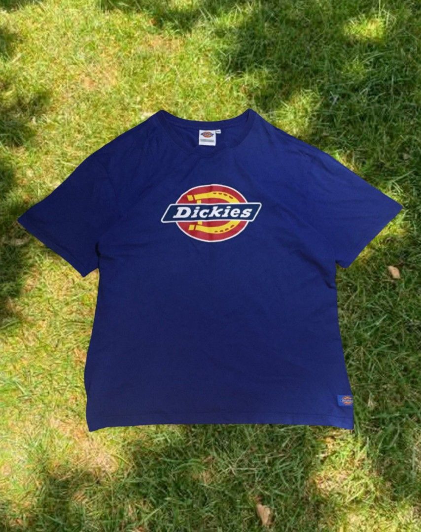 Dickies Blue T-Shirt XXL (Category: Tshirts & Polo Shirts ) located in Naga. Submitted by abouttocome (Listing ID 1469405721, Image 2). Description: - Brand: Dickies - Color: Royal Blue - Size: XXL - Material: 100% Cotton (Made in Indonesia) - Design: Large horseshoe logo on chest with small woven hem patch - Condition: Clean fabric with bright, vibrant colors.