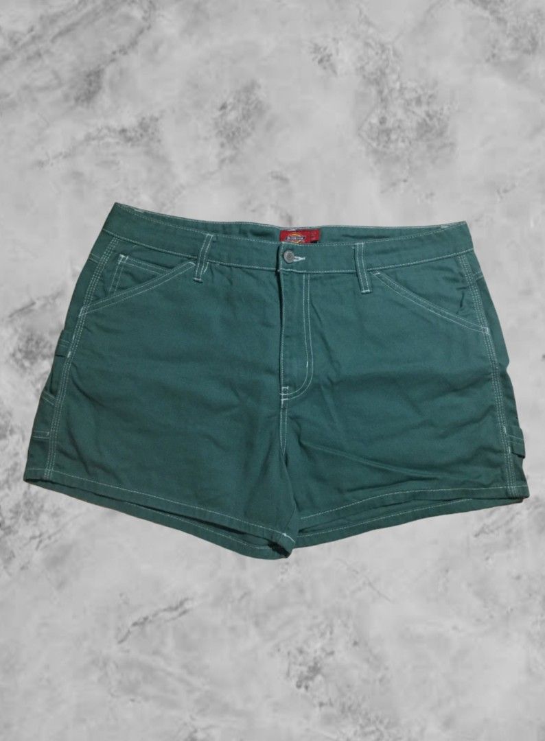 Dickies Green Cargo Shorts Size 15/32 (Category: Shorts) located in Naga. Submitted by abouttocome (Listing ID 1469405976, Image 1). Description: - Brand: Dickies - Color: Green denim with contrast white stitching - Size: 15/32 - Material: 100% durable cotton - Features: Multiple side and back pockets, utility loop, iconic red logo patch - Closure: Button closure with zip fly - Condition: Excellent everyday wear.