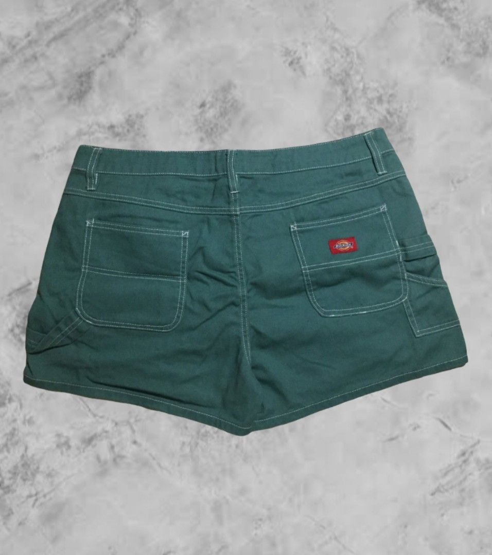 Dickies Green Cargo Shorts Size 15/32 (Category: Shorts) located in Naga. Submitted by abouttocome (Listing ID 1469405976, Image 2). Description: - Brand: Dickies - Color: Green denim with contrast white stitching - Size: 15/32 - Material: 100% durable cotton - Features: Multiple side and back pockets, utility loop, iconic red logo patch - Closure: Button closure with zip fly - Condition: Excellent everyday wear.