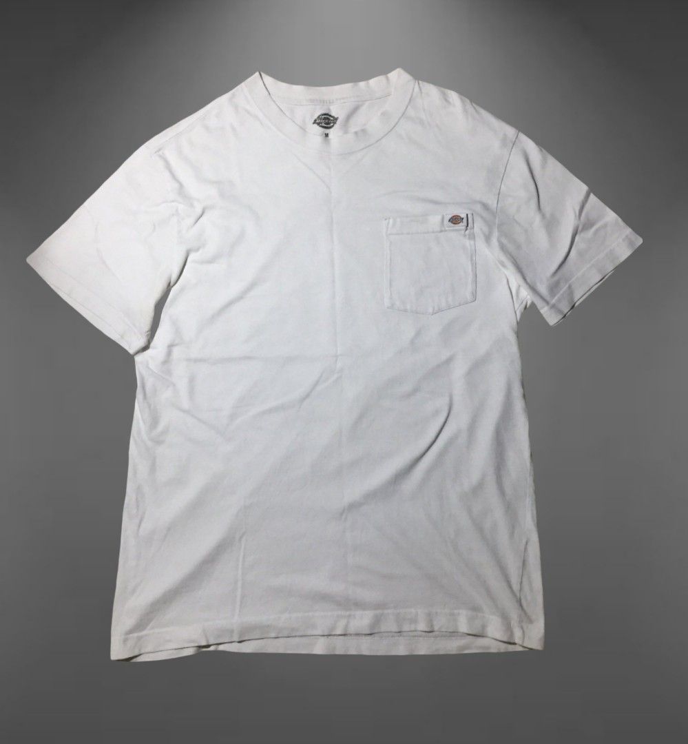 Dickies White Pocket T-Shirt Medium (Category: Tshirts & Polo Shirts ) located in Naga. Submitted by abouttocome (Listing ID 1469405284, Image 1). Description: - Brand: Dickies - Color: White - Size: Medium - Material: 100% Cotton (Made in India) - Design: Classic crewneck, short sleeves, and relaxed fit - Feature: Single chest pocket with iconic Dickies logo label - Condition: Great for pairing with denim or shorts.