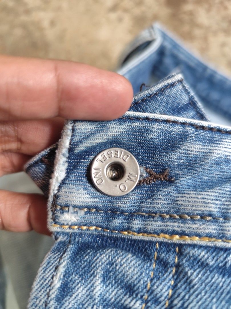 Diesel button fly jeans (Category: Jeans) located in Kabacan. Submitted by thriftpingts (Listing ID 1469435525, Image 3). Description: Diesel button fly rip jeans Condition: 10/10 Color rate : 10/10 Waist: 30-32 Length: 37 Hem: 7 Washtags: ✅ Issue: ❌.