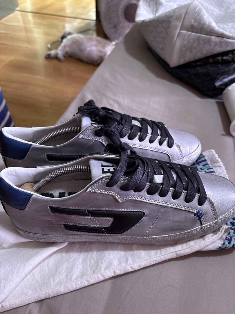 Diesel rubbershoes (Category: Sneakers) located in Binan City. Submitted by dabiescloset (Listing ID 1469422791, Image 2). Description: Diesel rubber shoes mens 7.5 euro 40. Bought sa States. Want to declutter. Used 2-3x the most. No bad smell good as new. No more box only paperbag. Receipt faded already cant see price. Similar to golden goose style. Color silver and blue. Bought for more than $250 .
