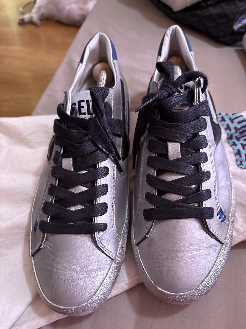 Diesel rubbershoes (Category: Sneakers) located in Binan City. Submitted by dabiescloset (Listing ID 1469422791, Image 1). Description: Diesel rubber shoes mens 7.5 euro 40. Bought sa States. Want to declutter. Used 2-3x the most. No bad smell good as new. No more box only paperbag. Receipt faded already cant see price. Similar to golden goose style. Color silver and blue. Bought for more than $250 .