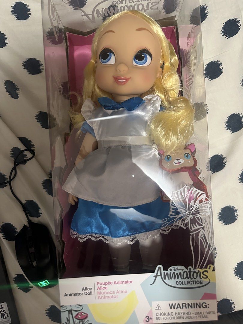 Disney Animators' Collection Alice Doll (Category: Plushies & Soft Toys) located in General Trias. Submitted by timeo99 (Listing ID 1469556809, Image 3). Description: - Official Disney Animators Collection Alice Doll - Features iconic blonde hair and blue eyes - Wears her classic blue and white dress with delicate lace trim - Comes brand new in original, intact packaging - Includes a cute small plush companion inside the box - Perfect for Disney 