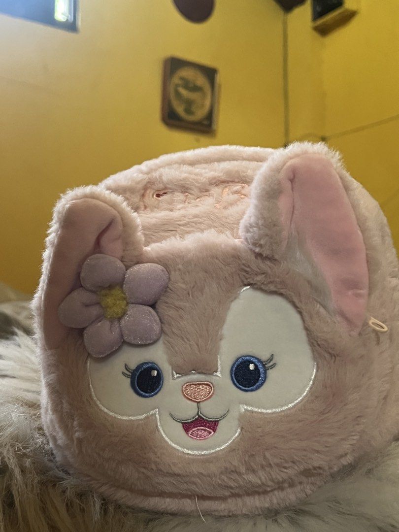 Disney Duffy and Friends LinaBell Plush Mini Backpack (Category: Backpacks) located in Rizal. Submitted by safecat_3c0d85 (Listing ID 1469430587, Image 2). Description: - Official-style LinaBell mini backpack in soft pink faux fur - Detailed front embroidery featuring LinaBell's face and purple flower - Embroidered name on the top flap - Chic gold hardware with dual zipper closure - Adjustable metallic pink straps for a comfortable fit - Compact 