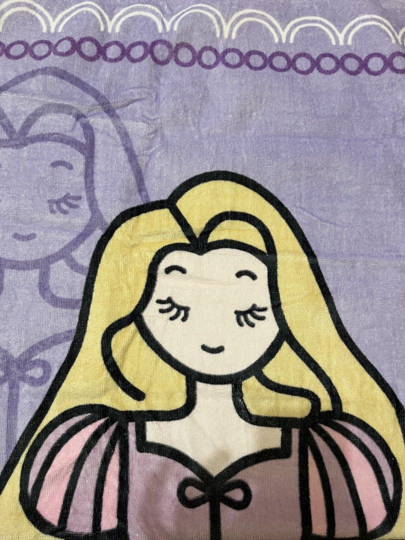 Disney Princesa Rapunzel Beach Towel (Category: Bedding & Towels) located in Manila. Submitted by kaye012222 (Listing ID 1469398393, Image 2). Description: - Official Disney Princess Rapunzel design in lovely purple and yellow - Material: 100% soft, high-quality cotton - Features vibrant printed graphics on the front with a plain white terry loop backing - Brand new with official Disney merchandise tag attached - Perfect for beach trips, pool day