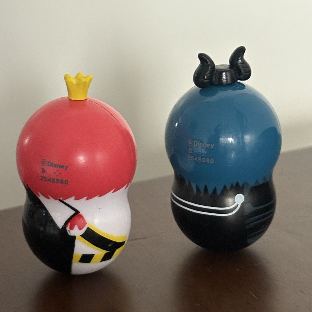 Disney Twist-style round character figures Balancer (Category: Figurines & Statues) located in Manila. Submitted by aobacafe (Listing ID 1469454456, Image 2). Description: - Set of 2 authentic Disney round character figures - Figure 1: Red hair with crown, black and white outfit - Figure 2: Blue hair, horns, black outfit - Features stamped Disney logo and production code on the back - Unique rounded bottom design - Selling as a set.