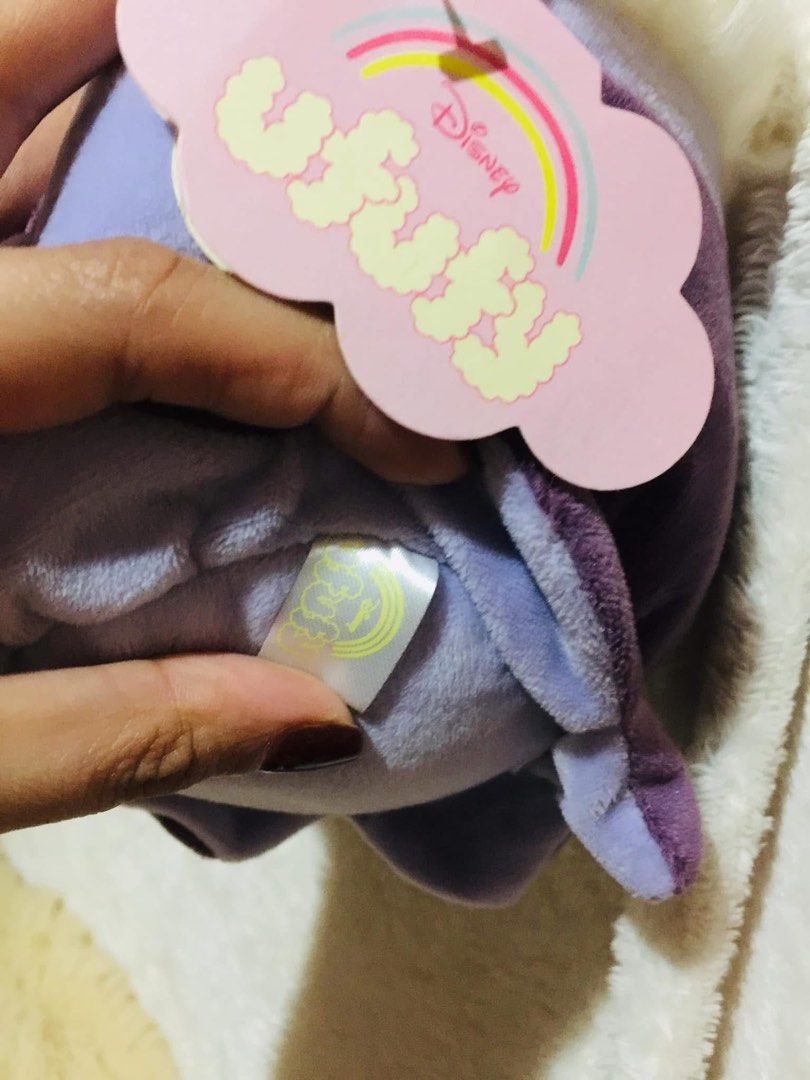 Disney Ufufy Ursula Plush Toy (Category: Plushies & Soft Toys) located in Baguio. Submitted by izza_thrifty (Listing ID 1469516692, Image 3). Description: - Authentic Disney Ufufy Ursula plush toy from The Little Mermaid - Features a soft purple body, white fuzzy hair, and embroidered seashell necklace detail - Original hanging tag with Disney Ufufy rainbow branding included - Super soft fabric texture all over - Pristine, clean condition with no