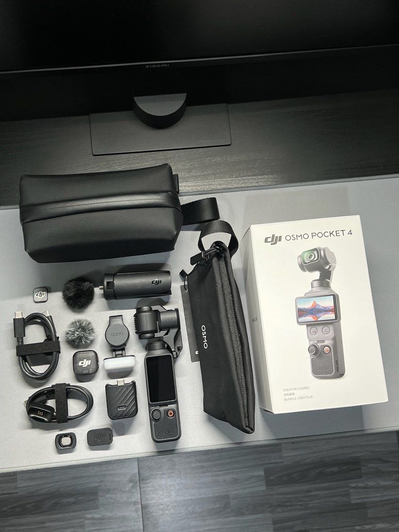 DJI Osmo Pocket 4 Creator Combo (Category: Video Cameras) located in Malabon City. Submitted by enricogomez (Listing ID 1469552629, Image 1). Description: DJI Osmo Pocket 4 Creator Combo • excellent condition • no issue • under warranty til Sept. 2027 Inclusions • osmo pocket 4 • gimbal clamp • handle with thread • fill light • wide-angle lens • transmitter (mic) • mic magnetic clip • mig magnetic charger • mic magnet • 2pcs windscreen • mini tri