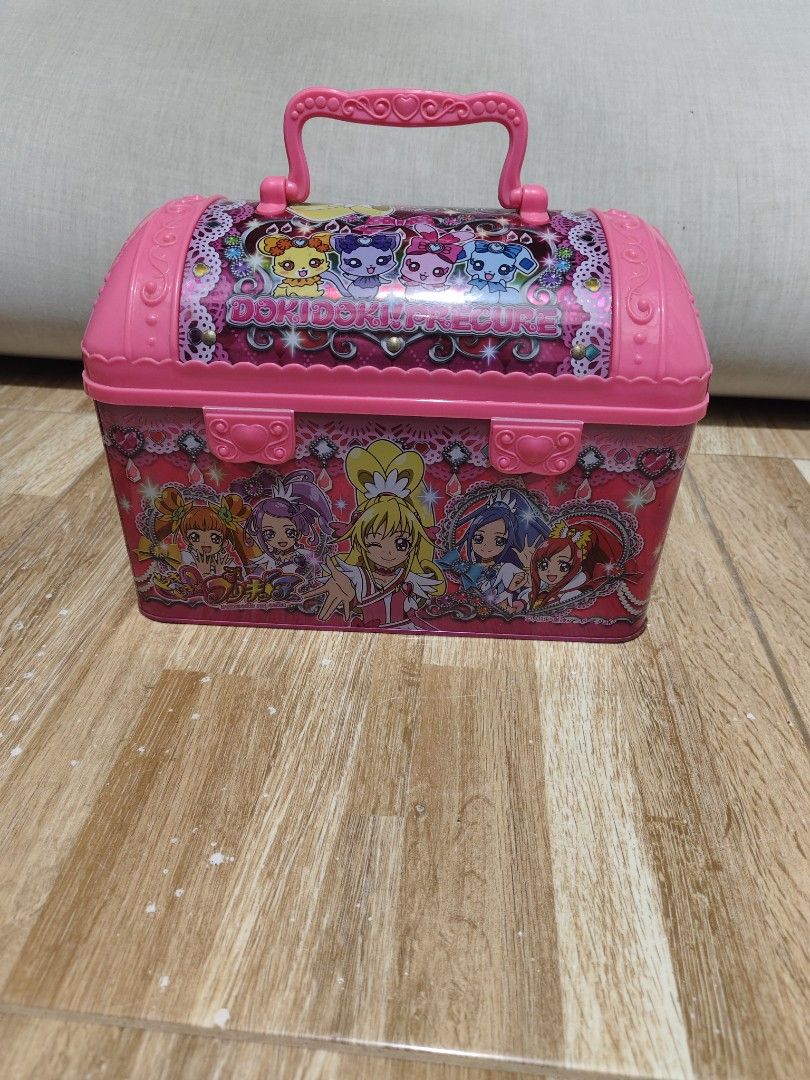 Dokidoki Precure Pink Tin Storage Box (Category: Storage Boxes & Baskets) located in Makati City. Submitted by abegailbrezuela (Listing ID 1469430088, Image 3). Description: - Official Doki Doki Precure merchandise - Cute pink metal chest with clear pink heart snap clasp - Convenient plastic top handle for easy carrying - Clean, empty pink metal interior - Features original Japanese product label and barcode on the back - Ideal collector's item f