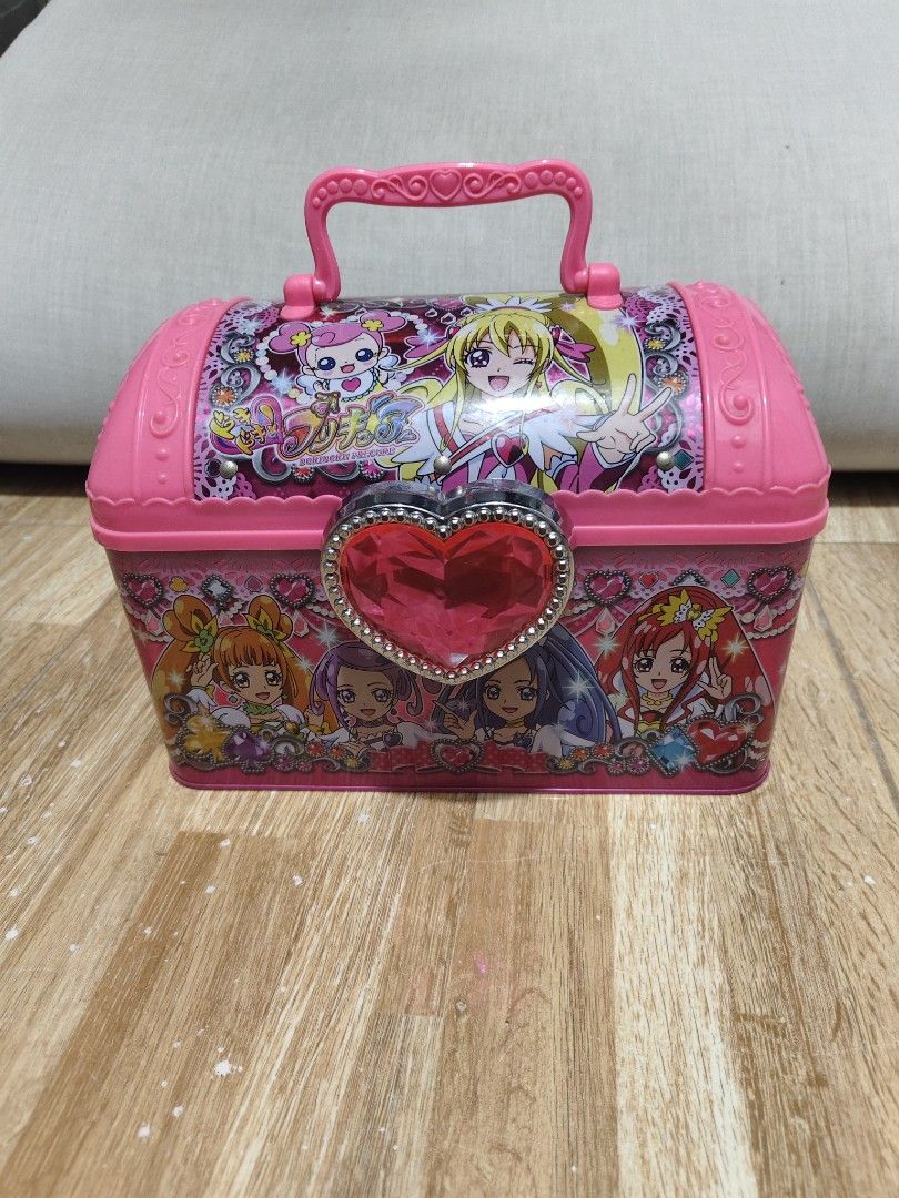 Dokidoki Precure Pink Tin Storage Box (Category: Storage Boxes & Baskets) located in Makati City. Submitted by abegailbrezuela (Listing ID 1469430088, Image 1). Description: - Official Doki Doki Precure merchandise - Cute pink metal chest with clear pink heart snap clasp - Convenient plastic top handle for easy carrying - Clean, empty pink metal interior - Features original Japanese product label and barcode on the back - Ideal collector's item f