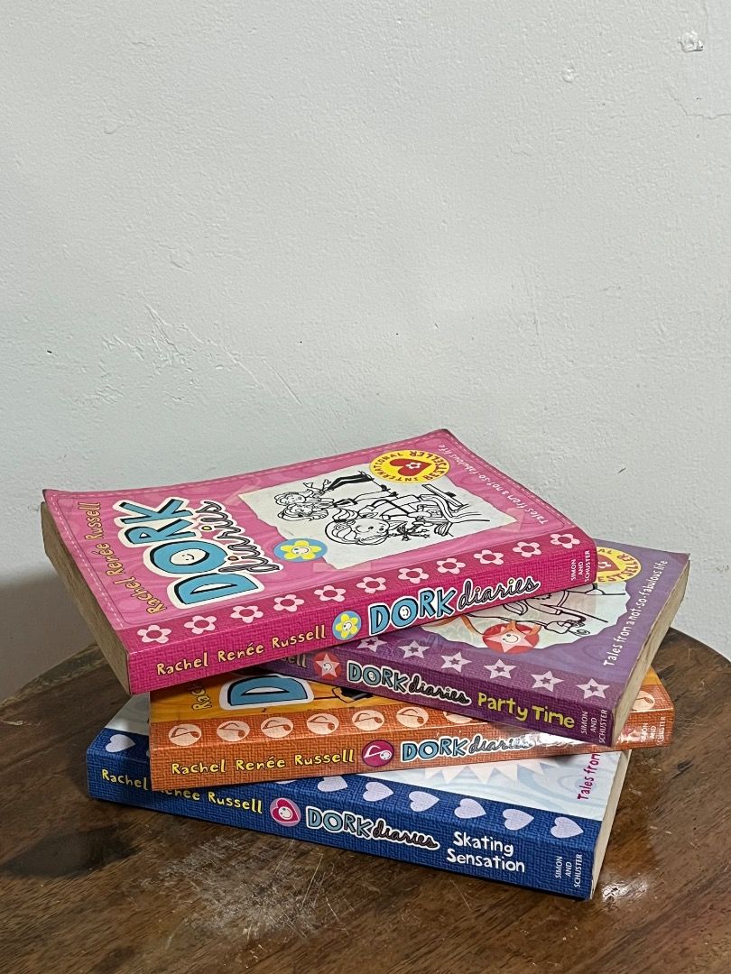 Dork Diaries Book Bundle (Category: Children's Books) located in Cabuyao City. Submitted by rdtrmt (Listing ID 1469412885, Image 1). Description: - Set of 4 Dork Diaries books by Rachel Renée Russell - Includes popular titles like Party Time, Skating Sensation, and Pop Star - Fun and engaging reads for kids, teens, and young at hearts - Condition: Pre-loved paperbacks with minor shelf wear on edges - Inside pages are clean and well-maintained but