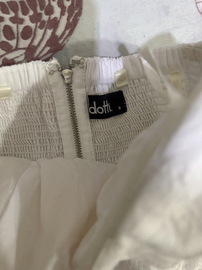 Dotti White Embroidered Strapless Corset Top Size 6 (Category: Sleeveless) located in Cebu City. Submitted by hotchkisscebu (Listing ID 1469424448, Image 3). Description: - Brand: Dotti - Size: 6 - Color: White with delicate floral embroidery - Details: Ruched side panels for stretch and fit - Closure: Exposed silver zipper and hook-and-eye clasp at the back - Condition: Clean fabric - Ideal for: Summer days and night outs Padded and boning Corse