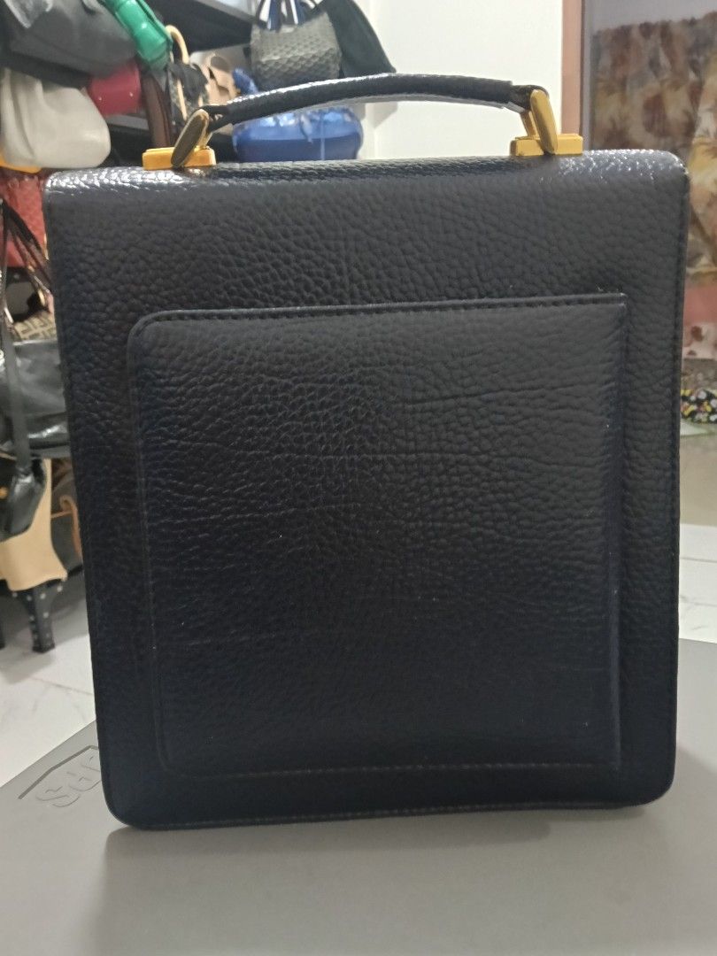 Double Fish Navy Blue Textured Leather Handbag with Strap (Category: Shoulder Bags) located in Bulacan. Submitted by abejeroamy80846 (Listing ID 1469509697, Image 2). Description: - Brand: Double Fish - Color: Navy Blue - Material: Genuine leather with textured pebbled grain finish - Hardware: Gold-tone with 'ITALY' engraved clasp - Design: Structured rectangular shape with a sturdy top handle and back pocket - Interior: Clean and spacious compar