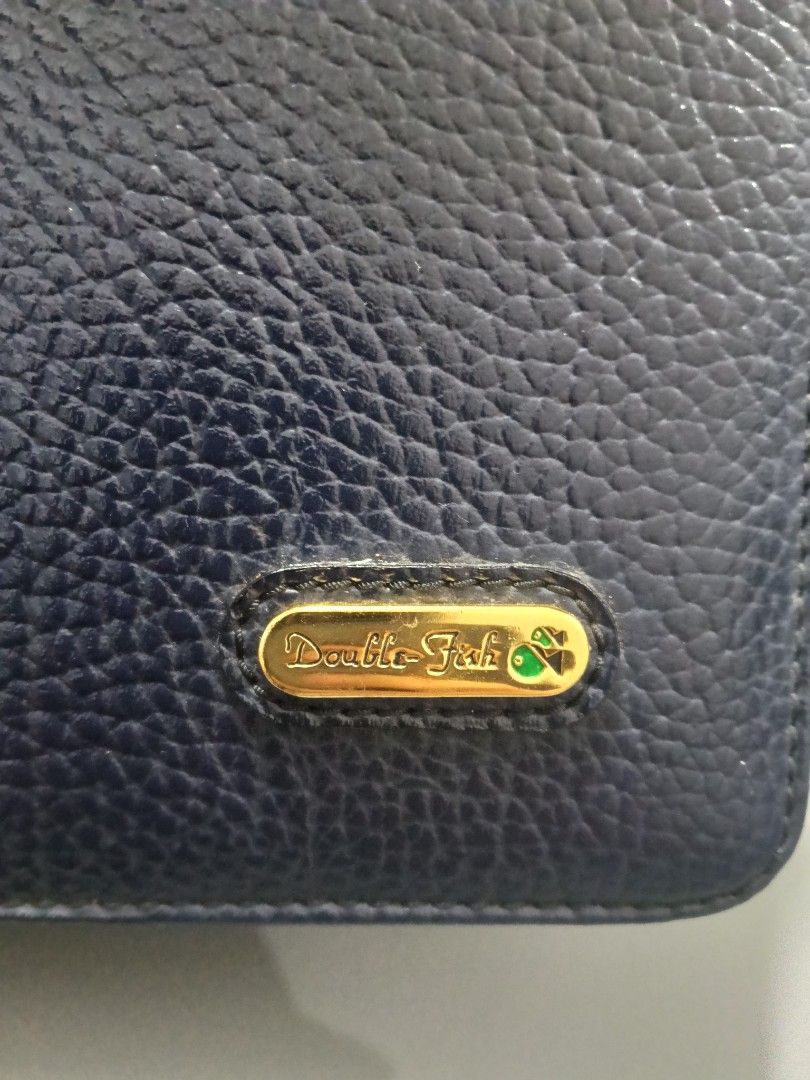 Double Fish Navy Blue Textured Leather Handbag with Strap (Category: Shoulder Bags) located in Bulacan. Submitted by abejeroamy80846 (Listing ID 1469509697, Image 3). Description: - Brand: Double Fish - Color: Navy Blue - Material: Genuine leather with textured pebbled grain finish - Hardware: Gold-tone with 'ITALY' engraved clasp - Design: Structured rectangular shape with a sturdy top handle and back pocket - Interior: Clean and spacious compar