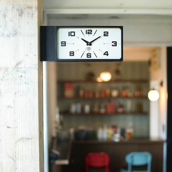 Dulton Double Sided Wall Clock (Category: Clocks) located in Malabon City. Submitted by dsrobles (Listing ID 1469533263, Image 1). Description: - Brand: Dulton (Established 1988) - Design: Modern industrial rectangular wall clock in sleek black - Dial: Clean white face with bold black numbering (1-12) - Versatile: Mounts easily on walls or stands upright on flat surfaces - Movement: Reliable battery-operated analog mechanism - Condition: Minimal 