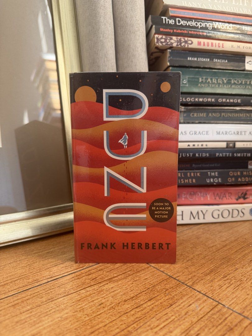 Dune by Frank Herbert Ace Paperback Novel (Category: Storybooks) located in Manila. Submitted by eliroth___ (Listing ID 1469464496, Image 1). Description: - Title: Dune by Frank Herbert - Edition: Ace paperback with movie tie-in cover - Special Feature: Includes afterword by Brian Herbert - Condition: Clean pages, solid spine, light shelf wear from storage - Perfect for: Sci-fi fans and movie enthusiasts.