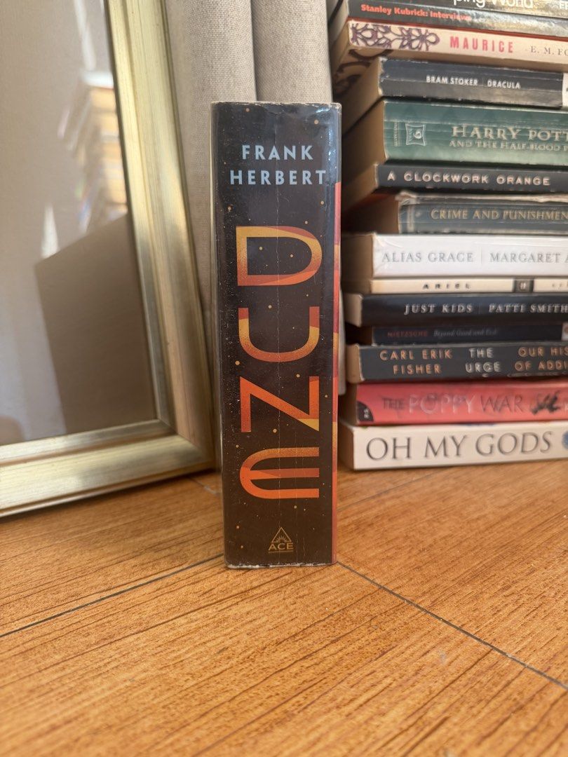 Dune by Frank Herbert Ace Paperback Novel (Category: Storybooks) located in Manila. Submitted by eliroth___ (Listing ID 1469464496, Image 2). Description: - Title: Dune by Frank Herbert - Edition: Ace paperback with movie tie-in cover - Special Feature: Includes afterword by Brian Herbert - Condition: Clean pages, solid spine, light shelf wear from storage - Perfect for: Sci-fi fans and movie enthusiasts.