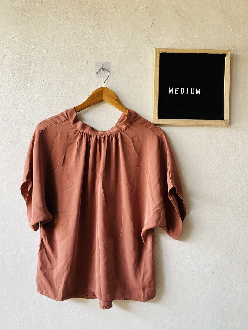 Dusty Pink Short Sleeve Pleated Blouse (Category: Blouses) located in Caloocan City. Submitted by lovemyclothes21 (Listing ID 1469407739, Image 1). Description: - Color: Dusty pink - Size: S (EUR/US/CA/MX S, CN 165/88B) - Fit: Relaxed fit, easy slip-on style - Details: Gathered neckline, short sleeves - Material: Smooth, lightweight fabric (Made in China) - Condition: Brand new / Excellent - Style: Versatile for casual days or work fits.