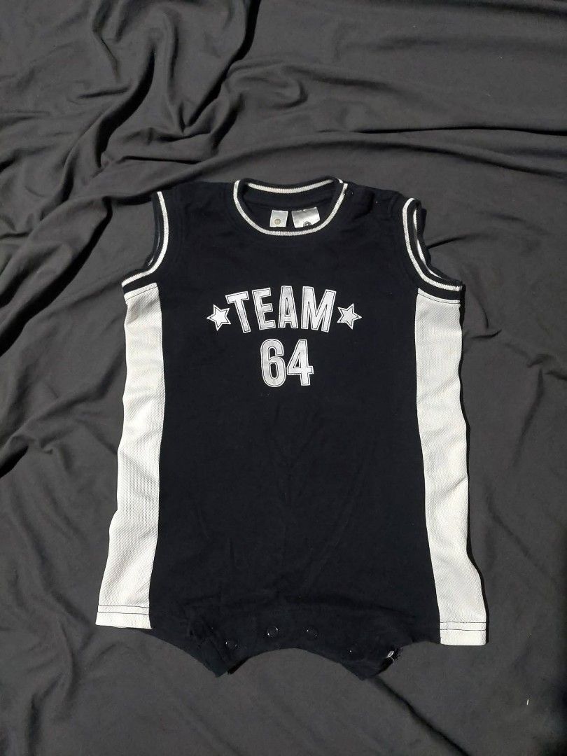 Dymples OOTD Romper Size 18 Months (Category: Babies & Kids Fashion) located in Manila. Submitted by ashibambum_05 (Listing ID 1469527964, Image 1). Description: - Brand: Dymples - Size: 12-18 months - Design: Black and white sleeveless basketball jersey style with breathable white mesh side panels - Graphic: Cool 'Team 64' print with stars on the front - Convenience: Snap button closure at the bottom for quick and hassle-free diaper changes.