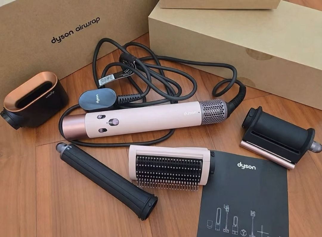 Dyson Airwrap Multi-Styler (Category: Hair) located in Marikina City. Submitted by coolocean-c9274f (Listing ID 1469471194, Image 1). Description: - Model: Dyson Airwrap multi-styler - Color: Strawberry Bronze and Blush Pink - Includes: Main wand, smoothing brush, curling barrels, and Coanda smoothing dryer attachment - Extras: Original presentation box and instruction manual - Condition: Flawless, zero marks or scratches - Ready to use with stan