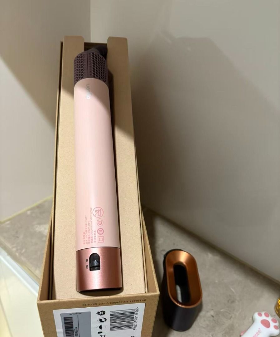Dyson Airwrap Multi-Styler (Category: Hair) located in Marikina City. Submitted by coolocean-c9274f (Listing ID 1469471194, Image 2). Description: - Model: Dyson Airwrap multi-styler - Color: Strawberry Bronze and Blush Pink - Includes: Main wand, smoothing brush, curling barrels, and Coanda smoothing dryer attachment - Extras: Original presentation box and instruction manual - Condition: Flawless, zero marks or scratches - Ready to use with stan