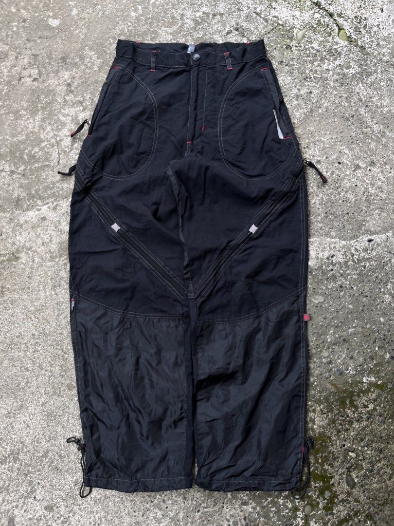 Ecko Function Nylon Cargo Pants Black Size L (Category: Joggers) located in Manila. Submitted by thrifttika (Listing ID 1469445713, Image 1). Description: - Brand: Ecko Function - Size: Large - Color: Black - Material: Durable ripstop nylon fabric with comfortable orange mesh lining - Design: Multiple utility zippers down the legs and detailed contrast stitching - Fit: Adjustable drawstrings at the leg openings - Details: Branded zipper pulls and