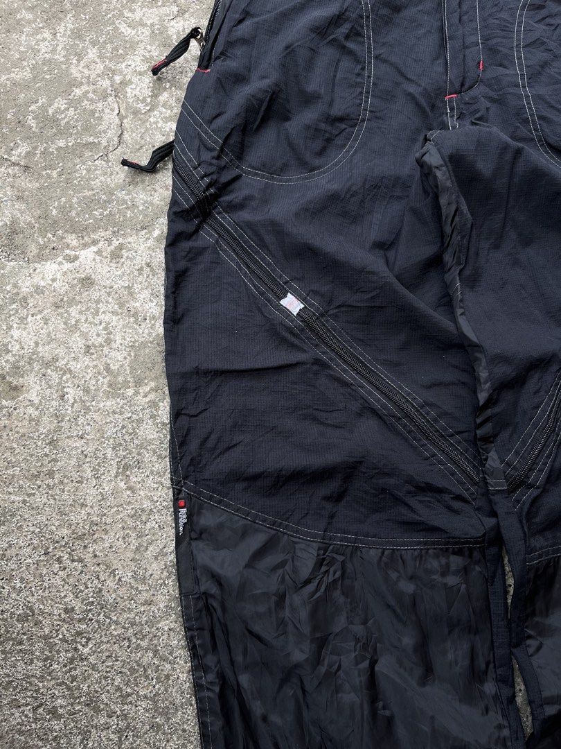 Ecko Function Nylon Cargo Pants Black Size L (Category: Joggers) located in Manila. Submitted by thrifttika (Listing ID 1469445713, Image 3). Description: - Brand: Ecko Function - Size: Large - Color: Black - Material: Durable ripstop nylon fabric with comfortable orange mesh lining - Design: Multiple utility zippers down the legs and detailed contrast stitching - Fit: Adjustable drawstrings at the leg openings - Details: Branded zipper pulls and