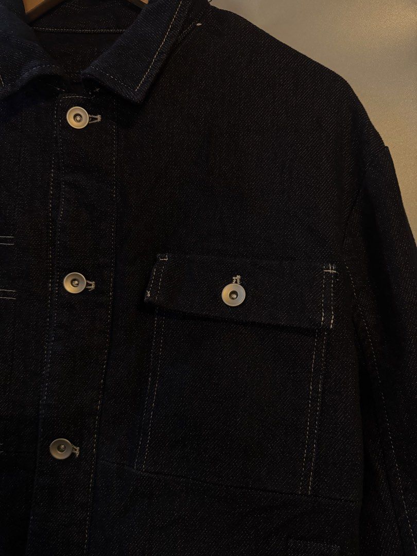 Ecko Unltd Dark Denim Jacket (Category: Coats, Jackets and Outerwear) located in Alaminos. Submitted by outfitcheck.ph (Listing ID 1469528202, Image 2). Description: - Brand: Ecko Unltd. - Color/Wash: Clean dark denim wash - Material: 57.5% cotton, 21.4% viscose, 20.1% polyester, 1% spandex (with slight stretch) - Design: Button-up front with metallic silver hardware and contrast white stitching - Pockets: Multiple functional patch pockets on the
