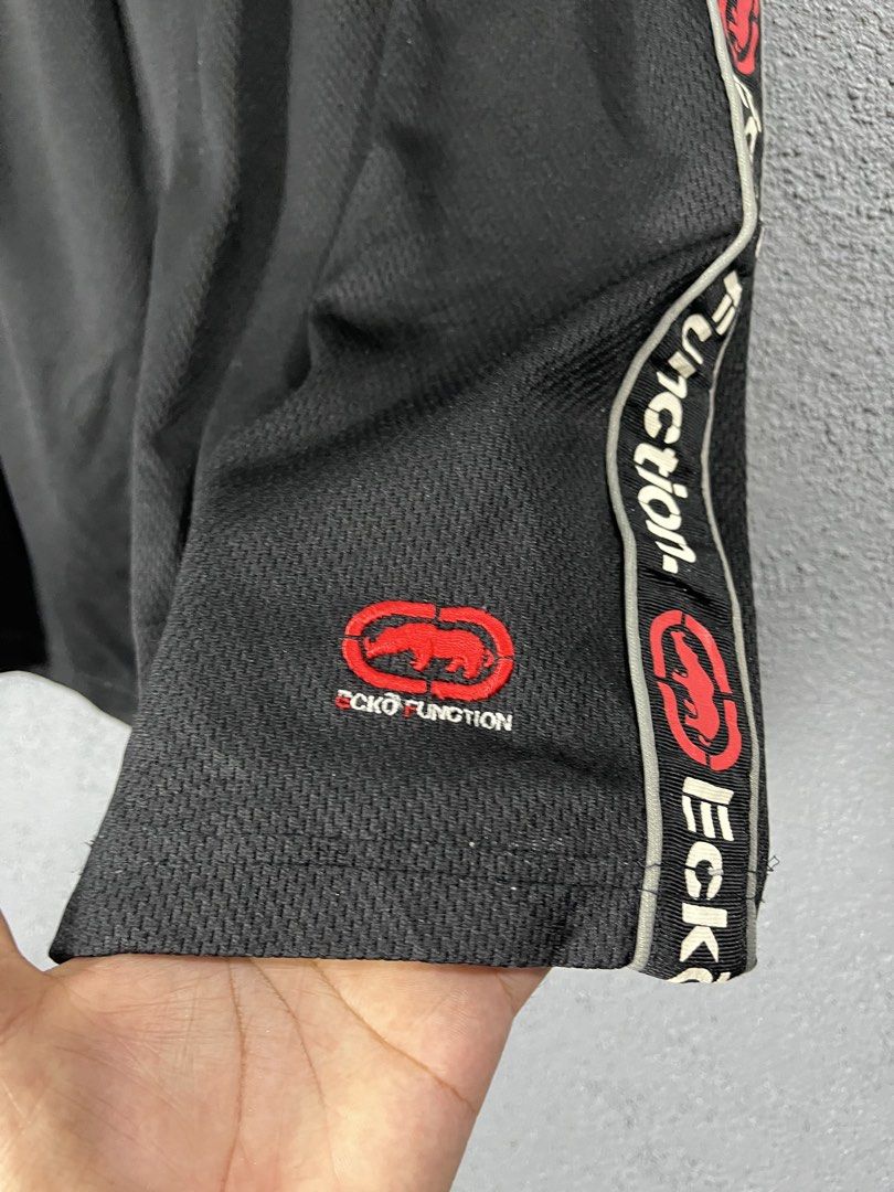 Ecko Unltd Ecko Function Black Mesh Shorts Size L (Category: Shorts) located in Famy. Submitted by basicthrifted (Listing ID 1469404733, Image 2). Description: - Brand: Ecko Function - Size: Large - Color: Black - Material: Breathable athletic mesh - Waistband: Elastic with drawstring closure - Pockets: Convenient side pockets - Details: Bold logo side taping and embroidered rhino logo on lower left leg - Condition: Excellent / Ready to wear.
