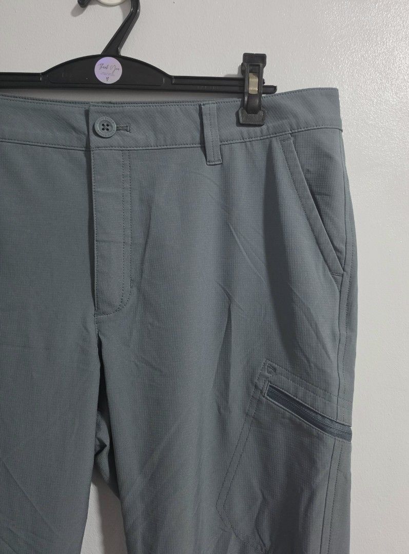 Eddie Bauer Grey Cargo drifit pants (Category: Other Bottoms) located in Paranaque City. Submitted by franinnashop (Listing ID 1469451921, Image 2). Description: Declutter - Brand: Eddie Bauer - Color: Grey - Size/Measurements: Waist 34-35", Hips 40", Length 33", Inseam 23" - Features: Secure zippered thigh pockets, adjustable drawstrings at cuffs - Details: Button closure with zip fly, belt loops, and standard back pockets - Condition: Excellent