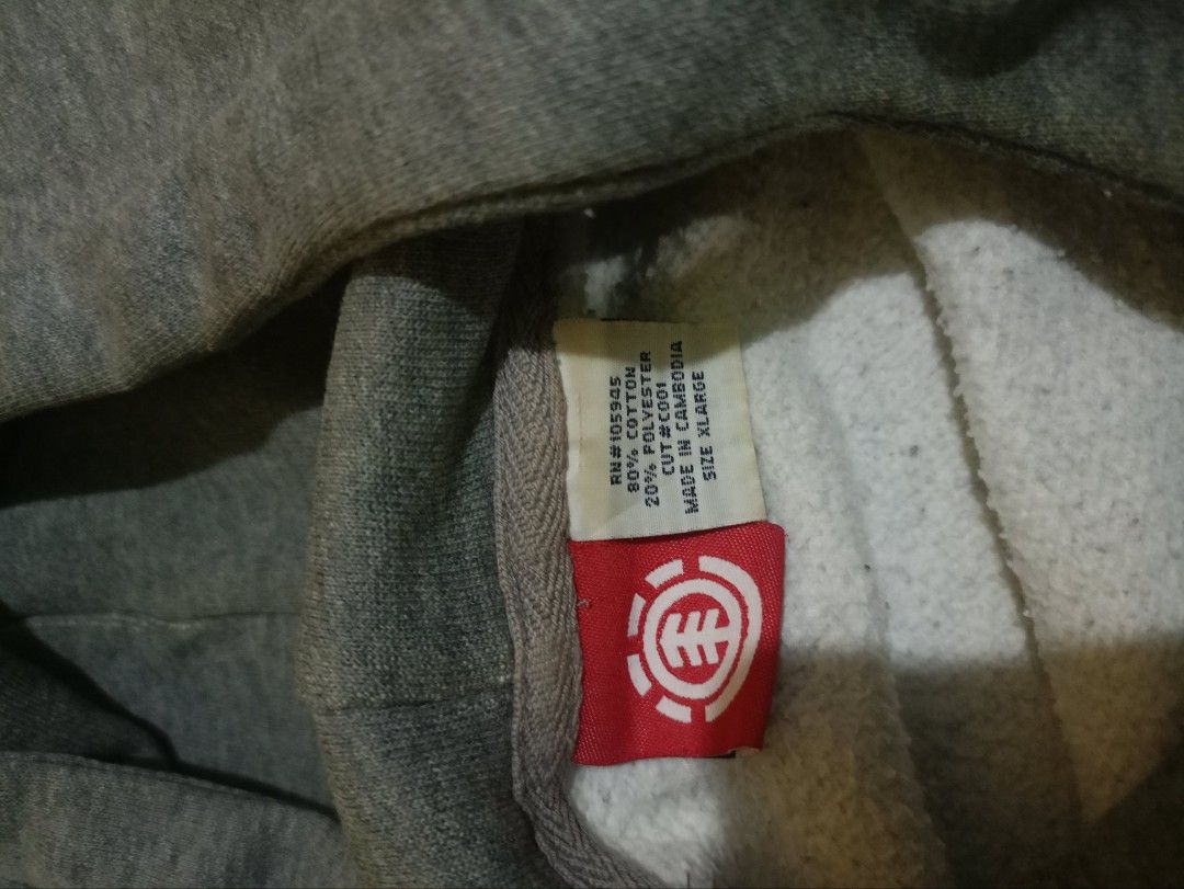 Element Wind Water Fire Earth Grey Hoodie (Category: Hoodies) located in General Mariano Alvarez. Submitted by markaj1699 (Listing ID 1469428455, Image 2). Description: - Brand/Style: Grey Element hoodie - Size: XL - Material: 80% cotton, 20% polyester with cozy fleece lining - Design: Element logo and 'wind water fire earth' text on front and both sleeves - Features: Adjustable drawstring hood - Origin: Made in Cambodia - Condition/Vibe: Warm an