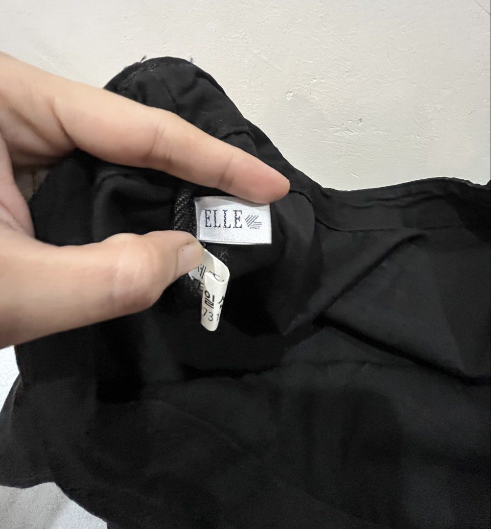 ELLE Black Tote Bag (Category: Tote Bags) located in Talisay. Submitted by cherylu (Listing ID 1469570229, Image 3). Description: - Brand: ELLE - Color: Black canvas with bold white logo lettering - Design: Open top with a roomy main compartment and dual shoulder straps - Details: Includes official interior brand tags - Style: Simple, chic, and versatile everyday carryall.