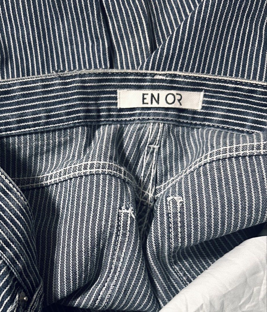 EN OR (Category: Jeans) located in Davao. Submitted by sart0ria85 (Listing ID 1469554088, Image 3). Description: blue gray and white vertical stripes all over in a Straight leg fitting. 100% COTTON MADE IN KOREA 🇰🇷 MEDIUM. Size 6 EXCELLENT CONDITION (92/100) - Features: Front pockets and zipper fly - Condition: Clean fabric, heavy vertical stripes style.