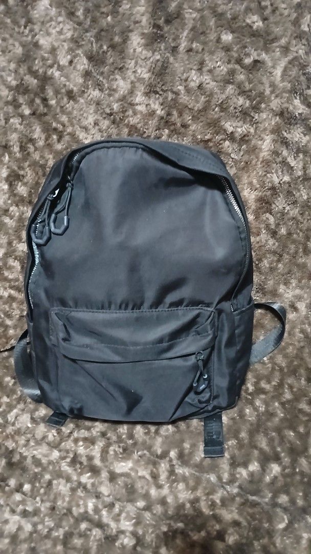 ENHYPEN x Bench Black Nylon Backpack (Category: Backpacks) located in Taguig. Submitted by jegadablo (Listing ID 1469501102, Image 1). Description: - Official ENHYPEN x Bench collaboration backpack - Color: Classic black nylon - Compartments: Main zip compartment and exterior front zip pocket - Details: Interior label with official ENHYPEN, Bench, and HYBE branding - Condition: Clean inside and out, lightweight and practical for daily use.