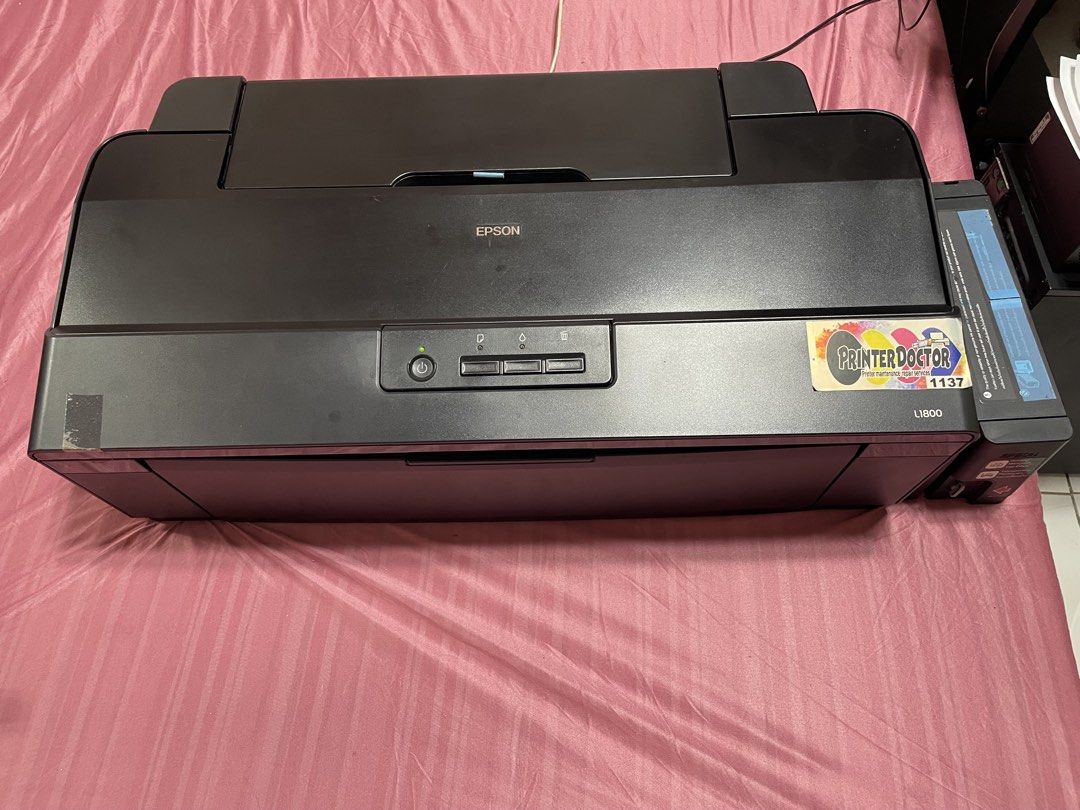 Epson L1800 Printer (Pigment Ink) (Category: Printers, Scanners & Copiers) located in Cavite. Submitted by ibennyfit (Listing ID 1469495868, Image 1). Description: Selling my preloved Epson L1800 printer. - print upto A3+ size - 6 colors - currently in pigment ink - new printhead - working and ready to use Honest issue: - yung rubber sa feeder niya pudpod na, kayo nalang po magpapalit sa technician, last price nila sakin is 500 pesos. - yung cove