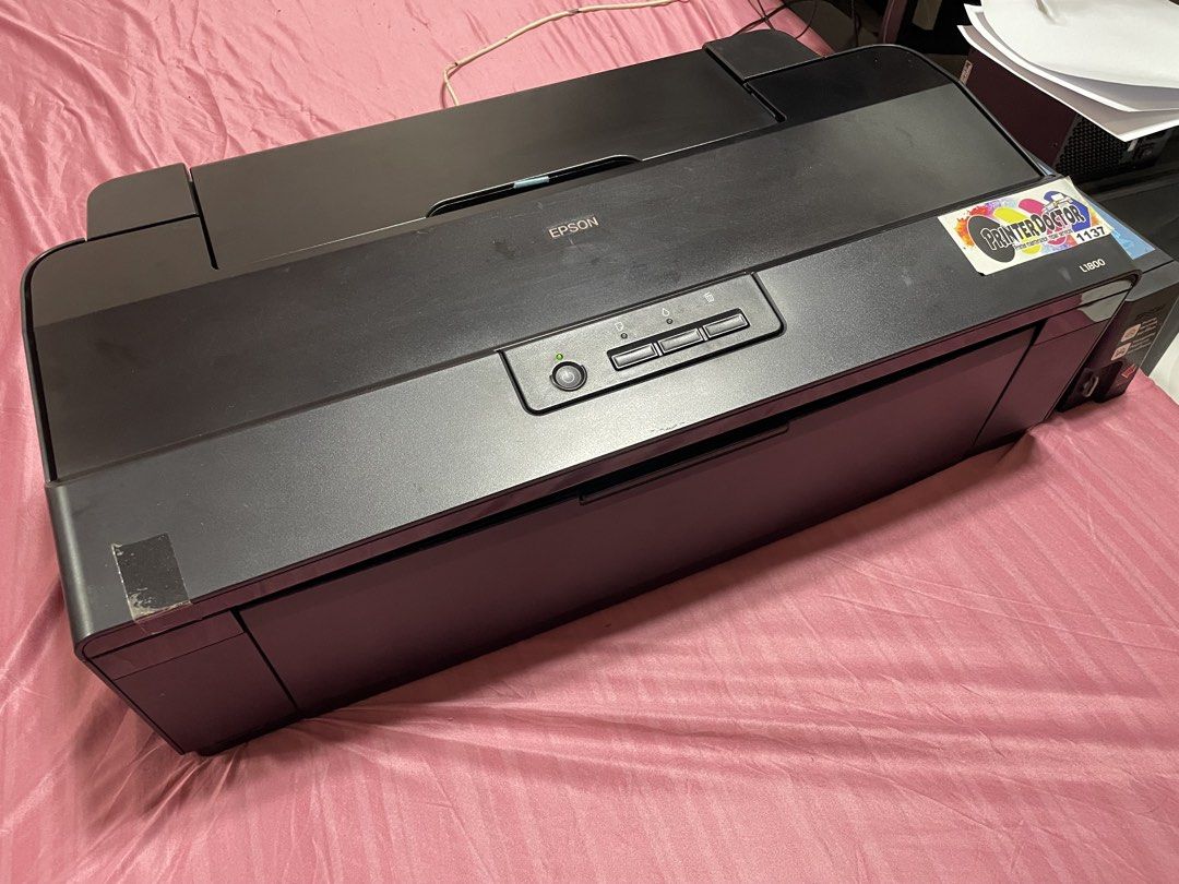Epson L1800 Printer (Pigment Ink) (Category: Printers, Scanners & Copiers) located in Cavite. Submitted by ibennyfit (Listing ID 1469495868, Image 2). Description: Selling my preloved Epson L1800 printer. - print upto A3+ size - 6 colors - currently in pigment ink - new printhead - working and ready to use Honest issue: - yung rubber sa feeder niya pudpod na, kayo nalang po magpapalit sa technician, last price nila sakin is 500 pesos. - yung cove