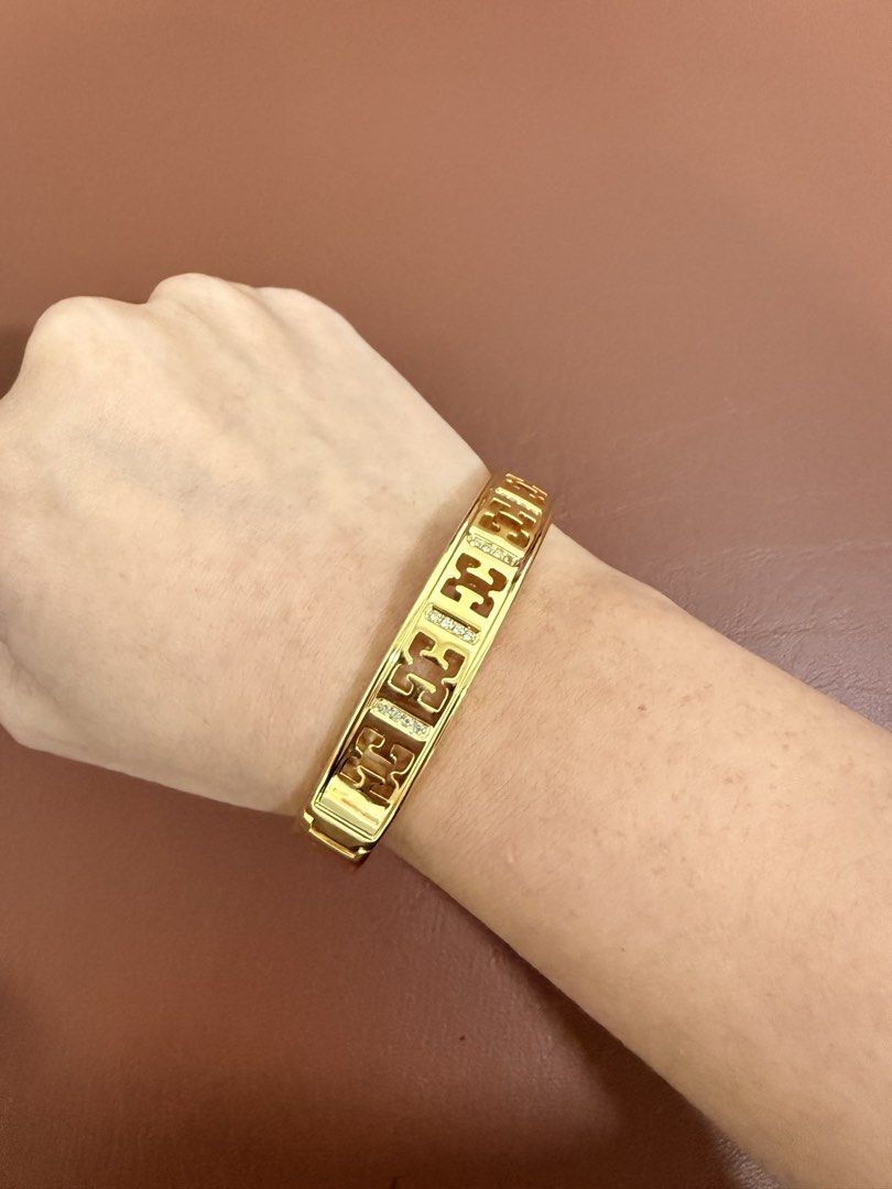 ESCADA Gold Tone Rhinestone Cutout Bangle Bracelet (Category: Bracelets) located in Quezon City. Submitted by anille (Listing ID 1469555248, Image 1). Description: - Elegant gold tone bangle bracelet with a chic cutout pattern - Embedded sparkling rhinestones between stations for extra shine - Textured back half design with a secure hinge clasp closure - Inner circumference measures approximately 7 inches - Features a shiny polished finish with m