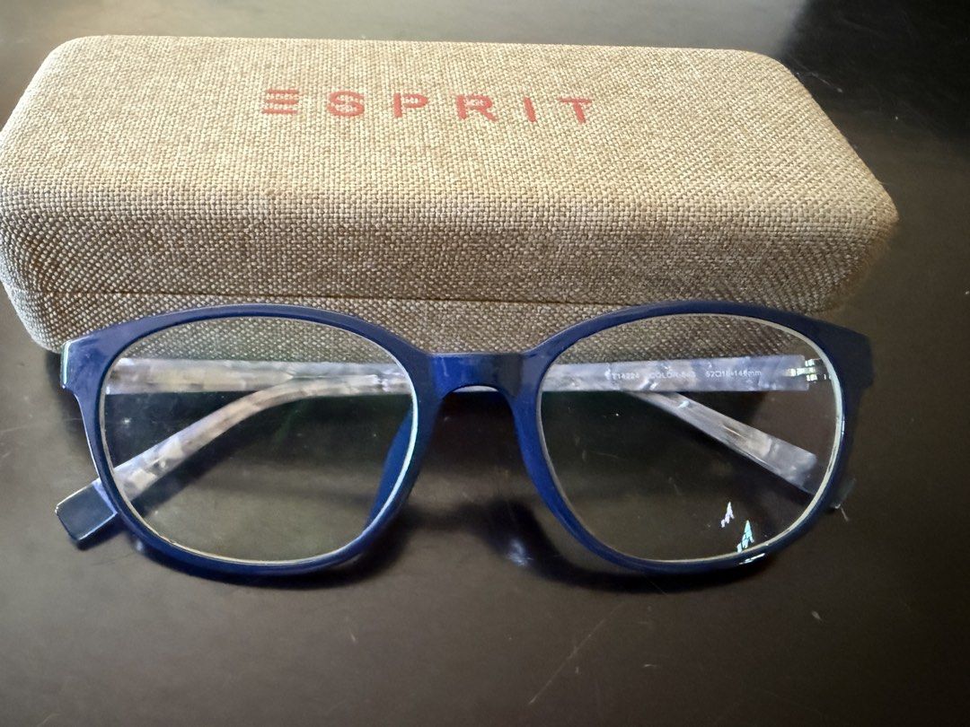Esprit ET14224 Blue Eyeglasses with Case (Category: Sunglasses & Eyewear) located in Marikina City. Submitted by maekristine.abadam (Listing ID 1469403225, Image 1). Description: - Model: ET14224 - Color: 543 (Blue frames with stylish marble-patterned arms) - Size: 52-18-146mm - Lenses: Clear demo lenses currently installed - Condition: Clean, well-maintained, with no major scratches or scuffs - Inclusions: Original textured hard case .