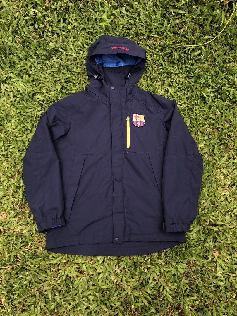 FC Barcelona Navy Blue Waterproof Hooded Jacket (Category: Coats, Jackets and Outerwear) located in Kabasalan. Submitted by hamugaway (Listing ID 1469567041, Image 1). Description: - Official FC Barcelona merchandise - Color: Navy blue with bright blue lining and hood interior - Size: 160 cm - Material: 100% nylon outer - Features: Bright yellow zip pocket, front zip with storm flap, and adjustable drawstrings on hood - Condition: Brand new/Excel
