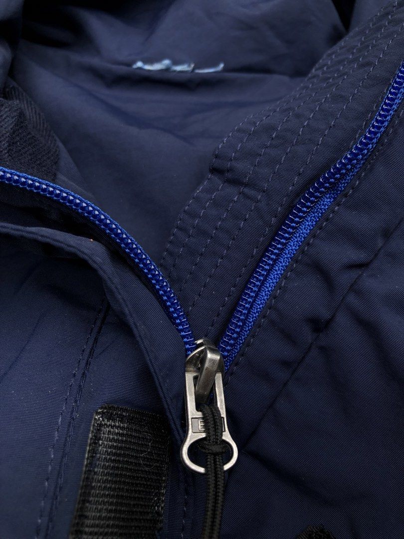FC Barcelona Navy Blue Waterproof Hooded Jacket (Category: Coats, Jackets and Outerwear) located in Kabasalan. Submitted by hamugaway (Listing ID 1469567041, Image 3). Description: - Official FC Barcelona merchandise - Color: Navy blue with bright blue lining and hood interior - Size: 160 cm - Material: 100% nylon outer - Features: Bright yellow zip pocket, front zip with storm flap, and adjustable drawstrings on hood - Condition: Brand new/Excel