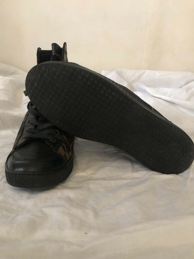 Fendi High Top Sneakers Monogram Black Brown (Category: Sneakers & Footwear) located in Manila. Submitted by wonderboi80 (Listing ID 1469520393, Image 3). Description: - Brand: Fendi - Style: High-top streetwear sneakers - Design: Classic black and brown monogram pattern with leather toe caps - Details: Lace-up front featuring durable metal eyelets and sturdy rubber soles - Condition: Normal wear on soles and uppers, fully ready for daily wear - 