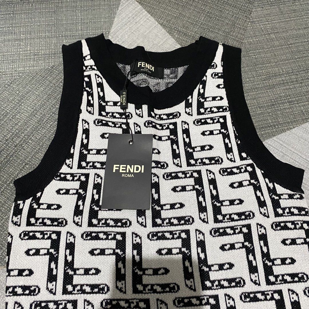 Fendi Monogram Knit Dress (Category: Dresses) located in Magalang. Submitted by lyan0916 (Listing ID 1469513384, Image 2). Description: - Brand: Fendi - Style: Knit midi dress - Pattern: Black and white monogram throughout - Design: Round neckline, sleeveless cut, and contrasting black ribbed trim - Condition: Brand tags attached to the collar - Perfect for effortless luxury styling Message me for more details ☺️.