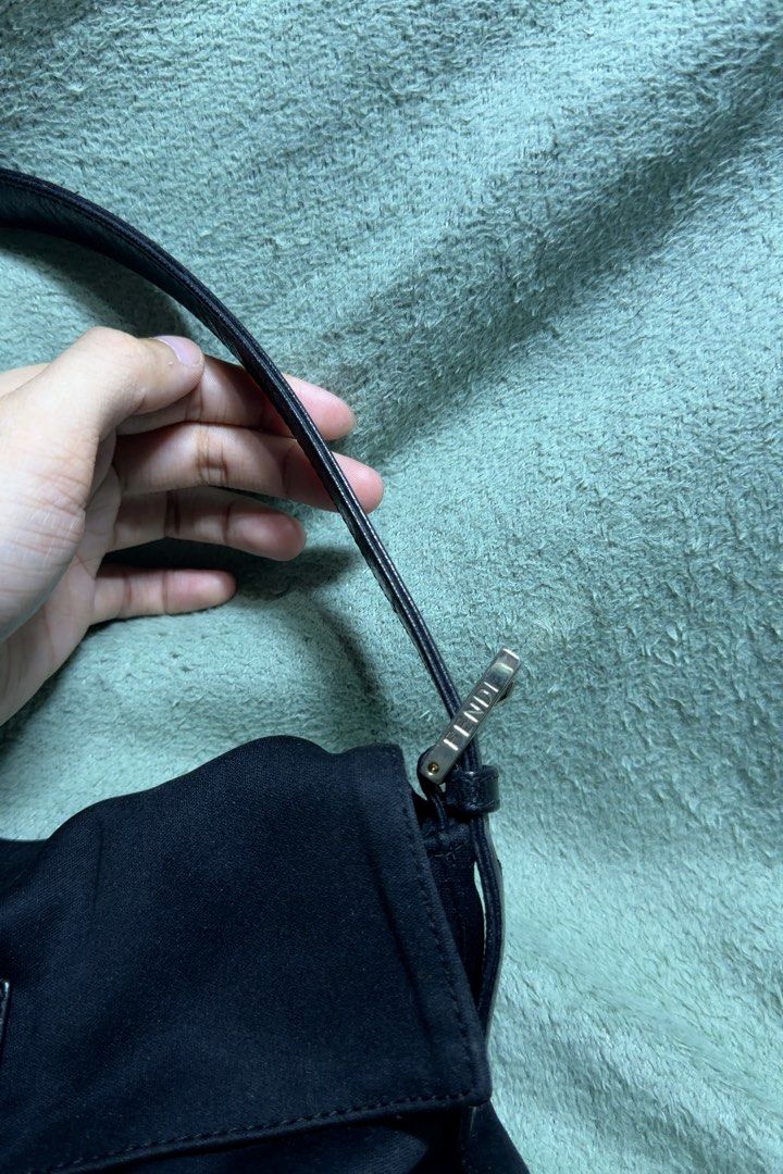 Fendi Neoprene Baguette (Black) (Category: Luxury Bags & Wallets) located in Makati City. Submitted by joshdelrey (Listing ID 1469517050, Image 3). Description: Authentic Fendi Neoprene Baguette (Black) - Has F logo underzip - Sticky texture - Has cracking on the handle 📍Makati .